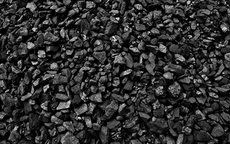 Pile of black petroleum coke granules